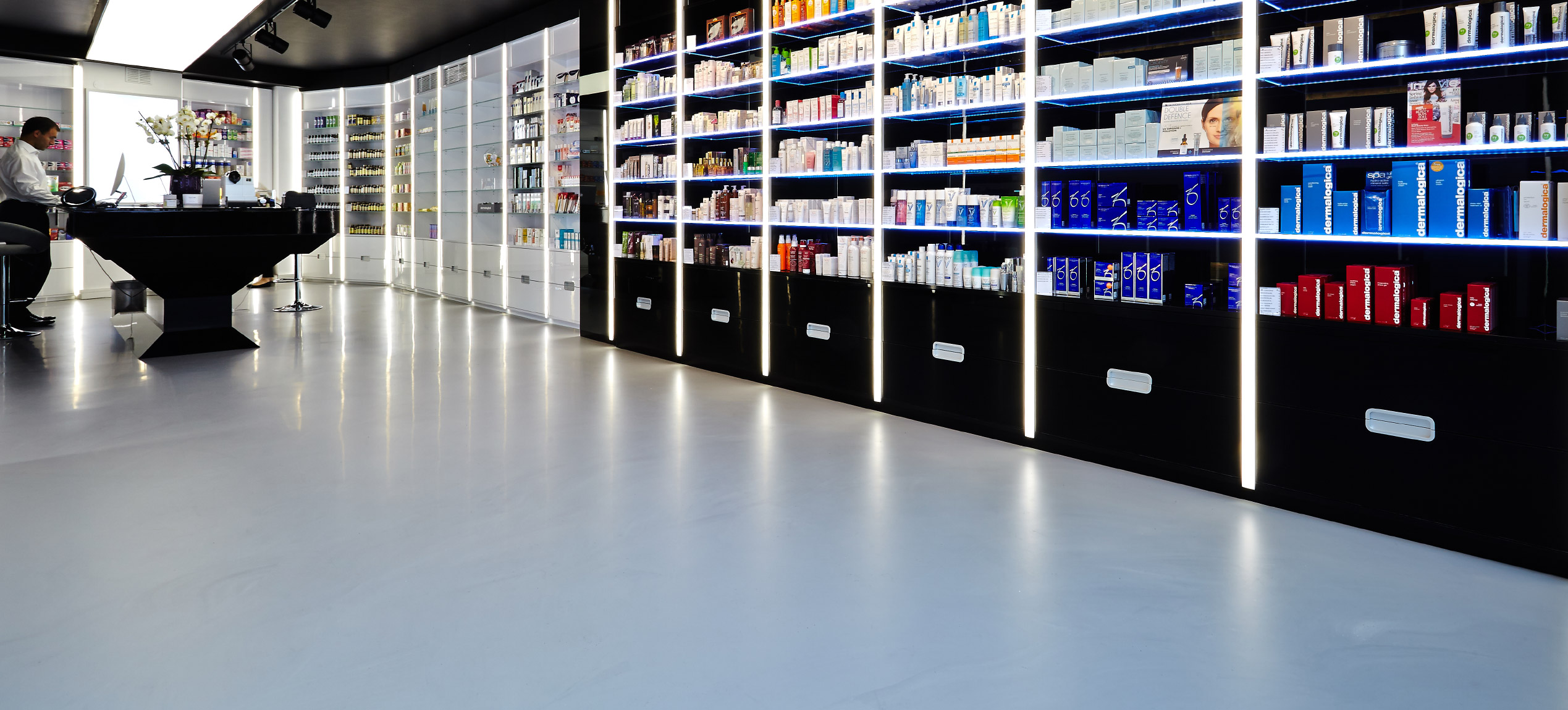 Beauty clinic with light grey resin floors